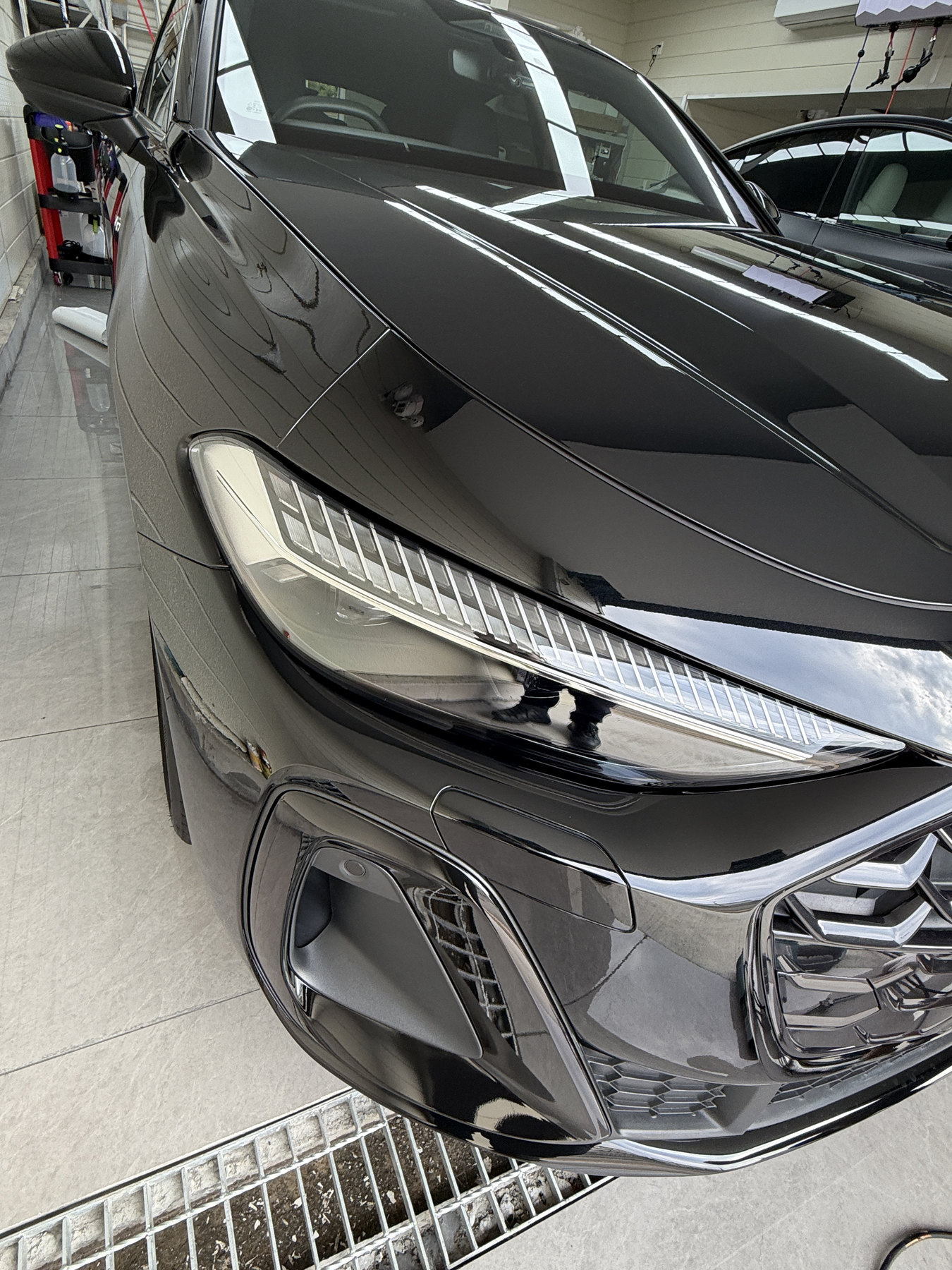 Audi A5 front bumper blackout after 3M 2080 HG12 After: angled front view