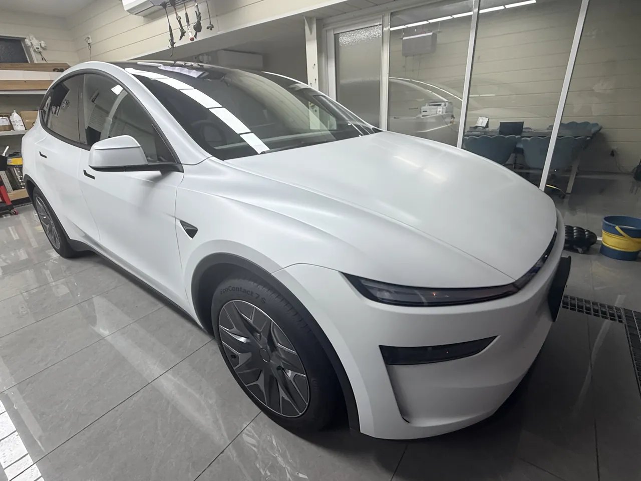 White Tesla Model Y L after satin clear PPF and matte black window-trim installation