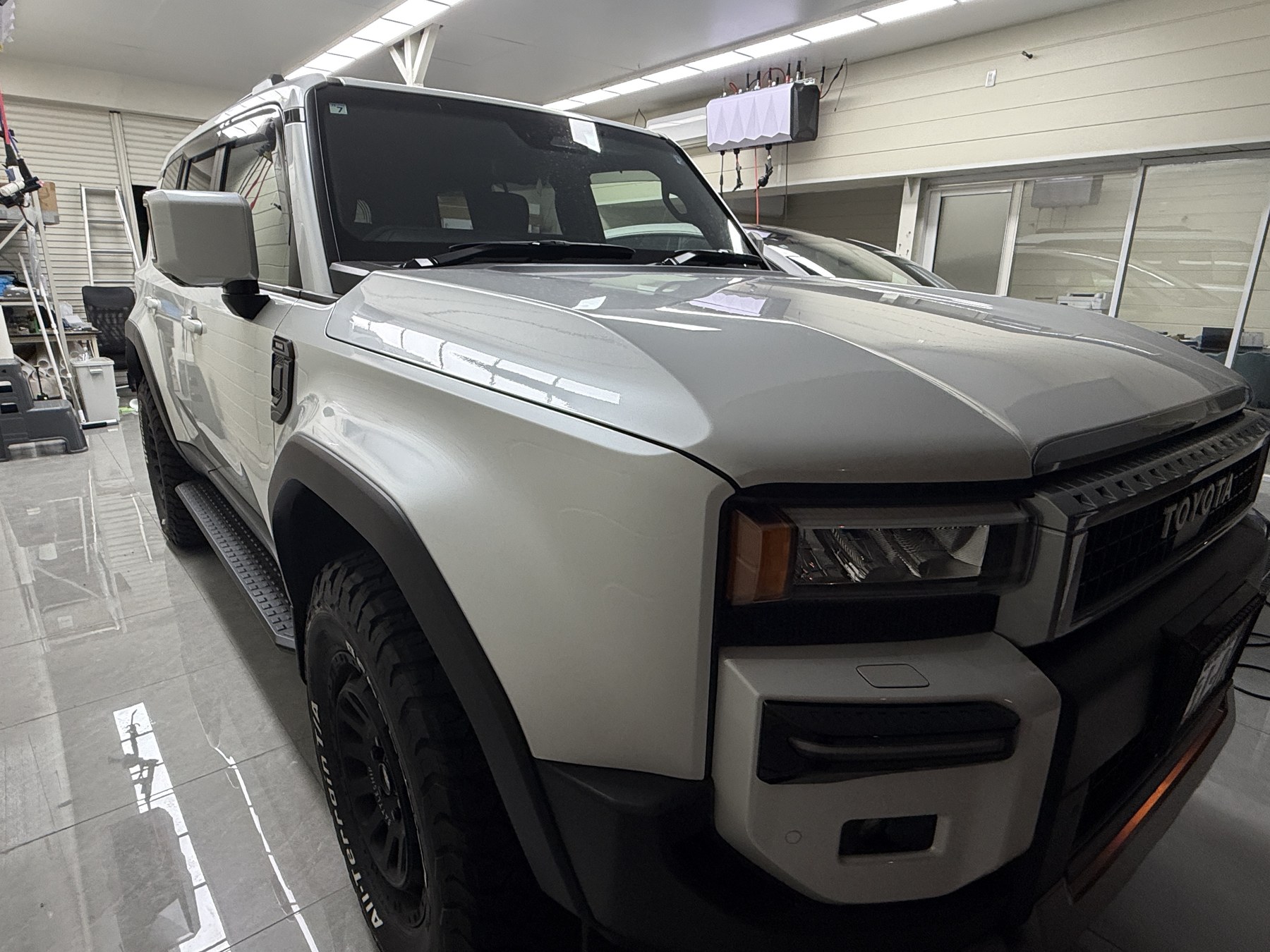 2026 Land Cruiser 250 glossy white paint before clear matte PPF, front quarter view