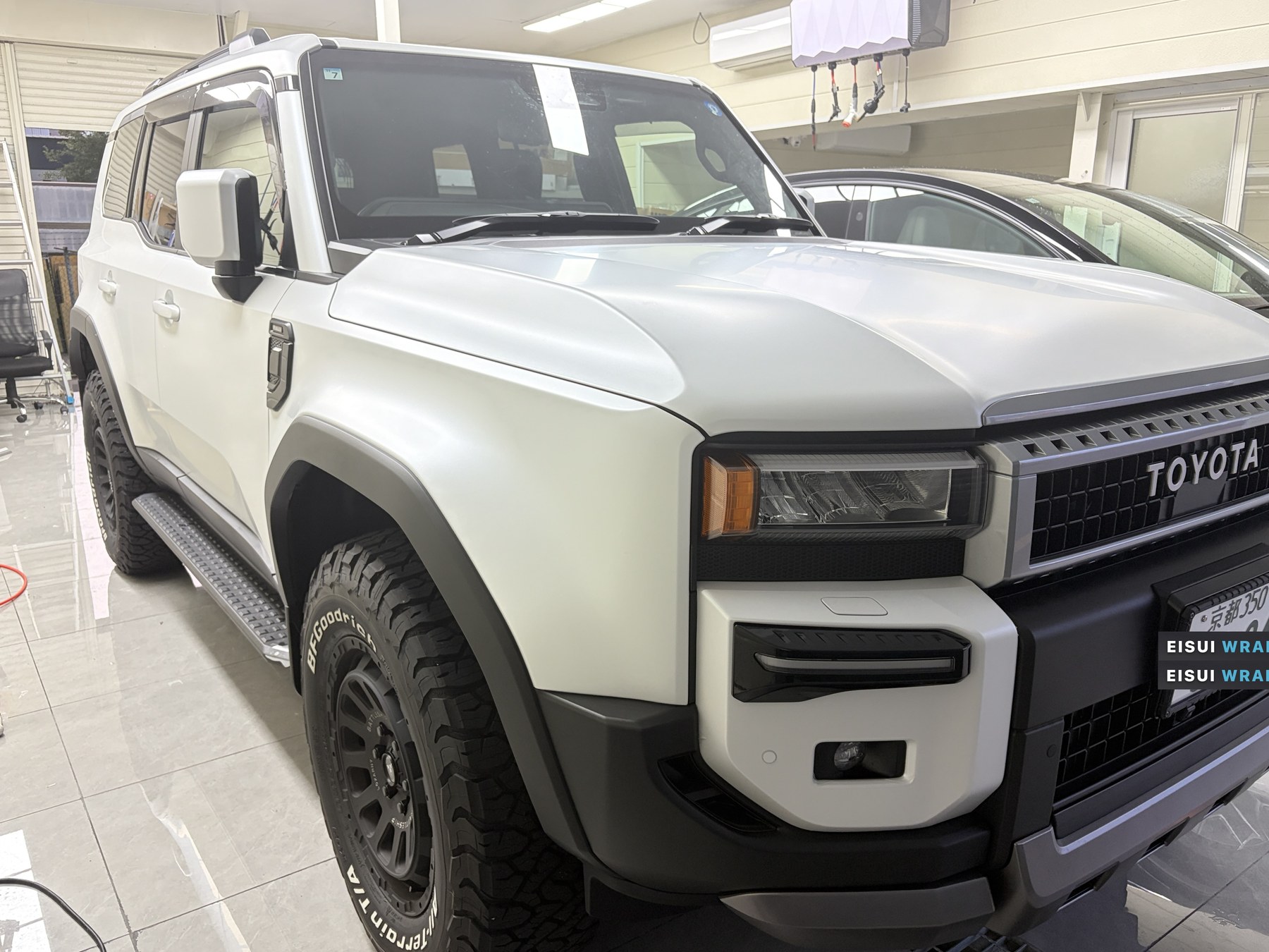 2026 white Land Cruiser 250 after EISUI Clear Matte PPF, front quarter at EISUI WRAP Osaka