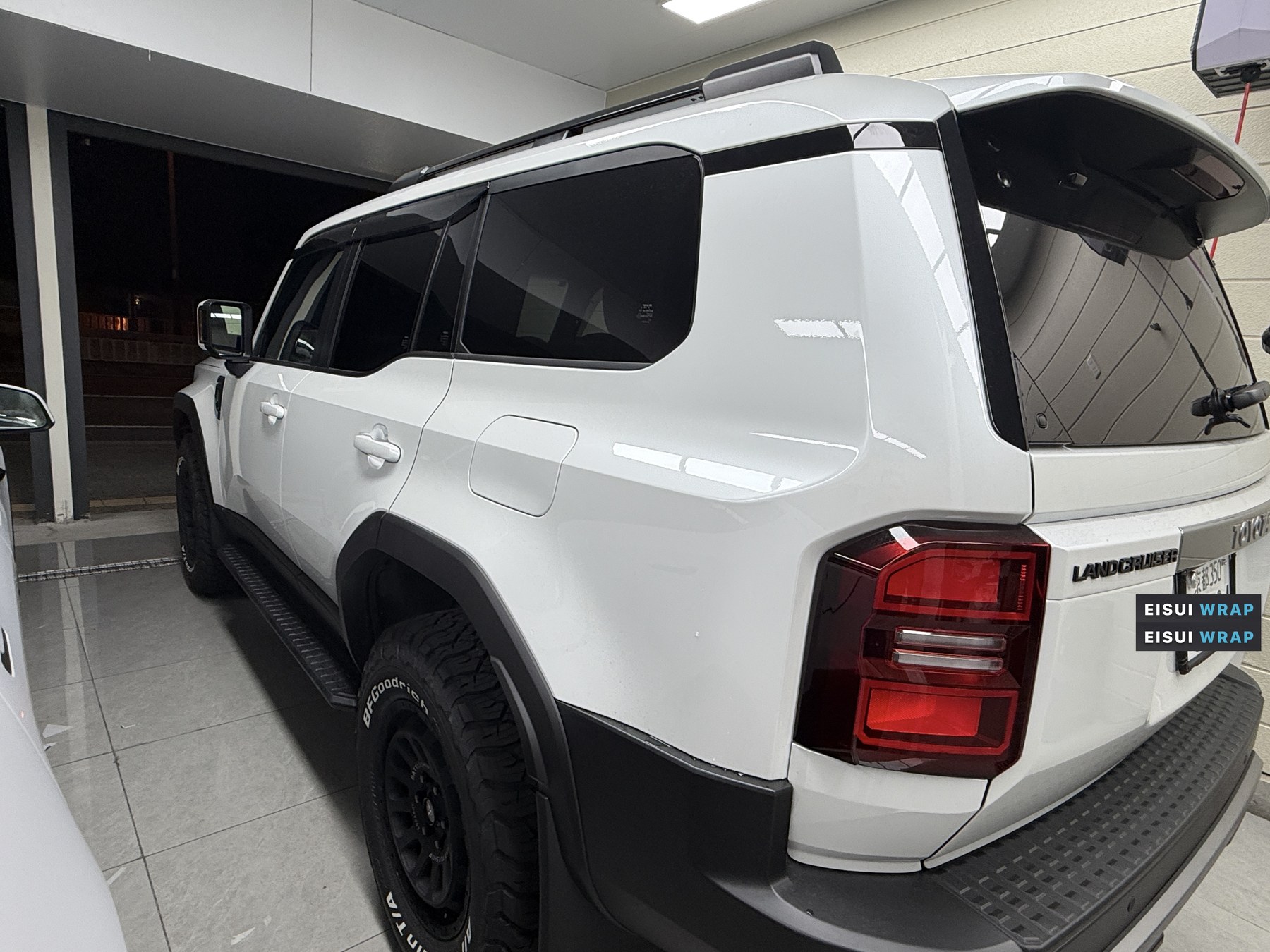 2026 Land Cruiser 250 glossy white paint before clear matte PPF, rear quarter view
