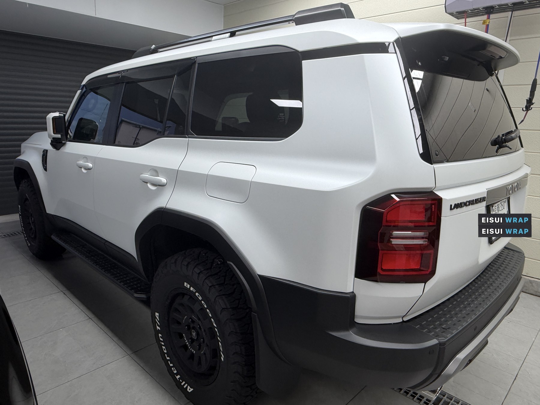 Land Cruiser 250 white body after EISUI clear matte PPF, rear quarter view