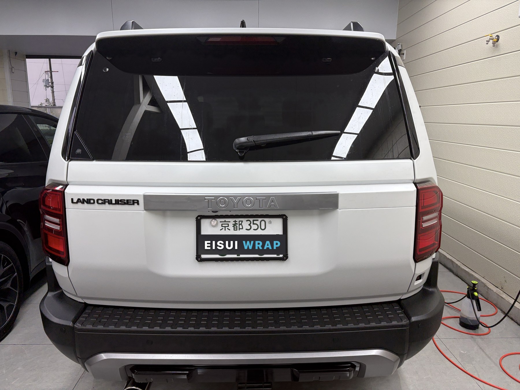 Land Cruiser 250 white body after EISUI clear matte PPF, rear view