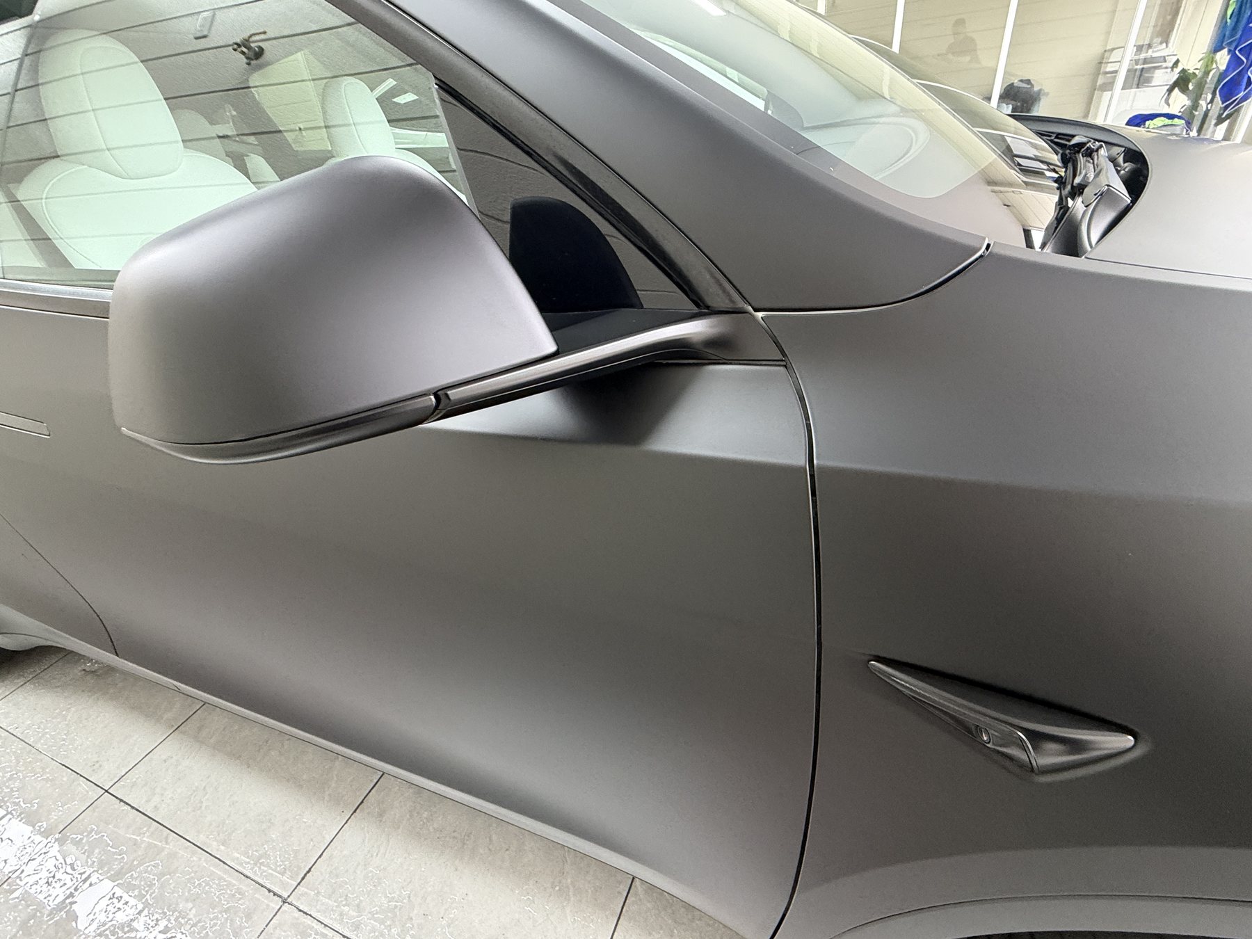 2024 Tesla Model Y after color PPF, mirror and front door
