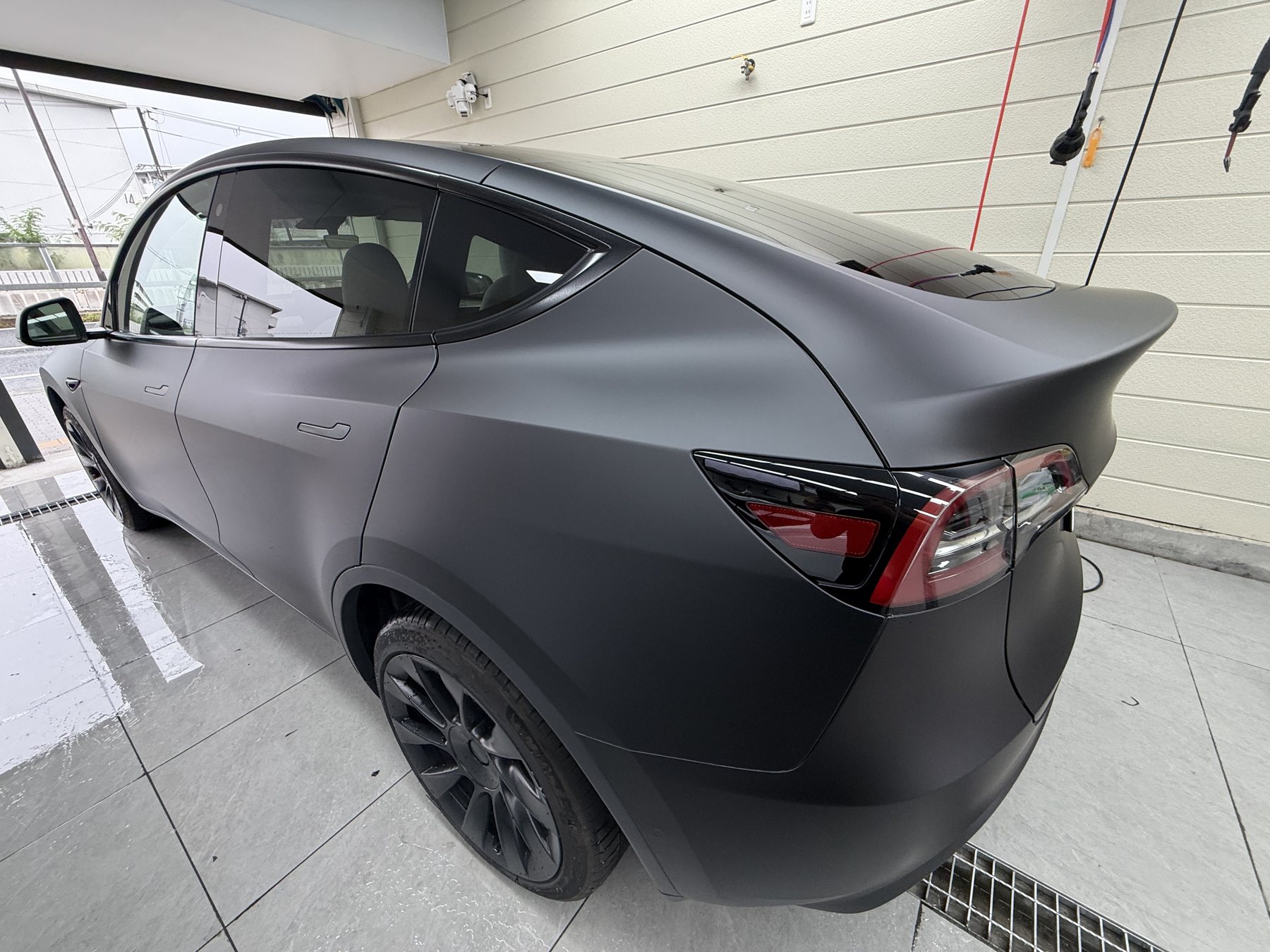 2024 Tesla Model Y matte black after EISUI color PPF, rear quarter