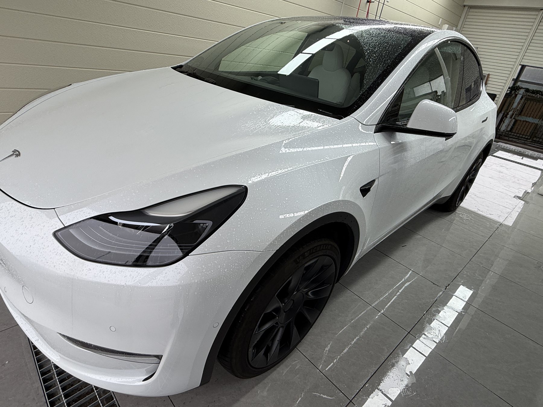 2024 Tesla Model Y pearl white before color PPF, front quarter