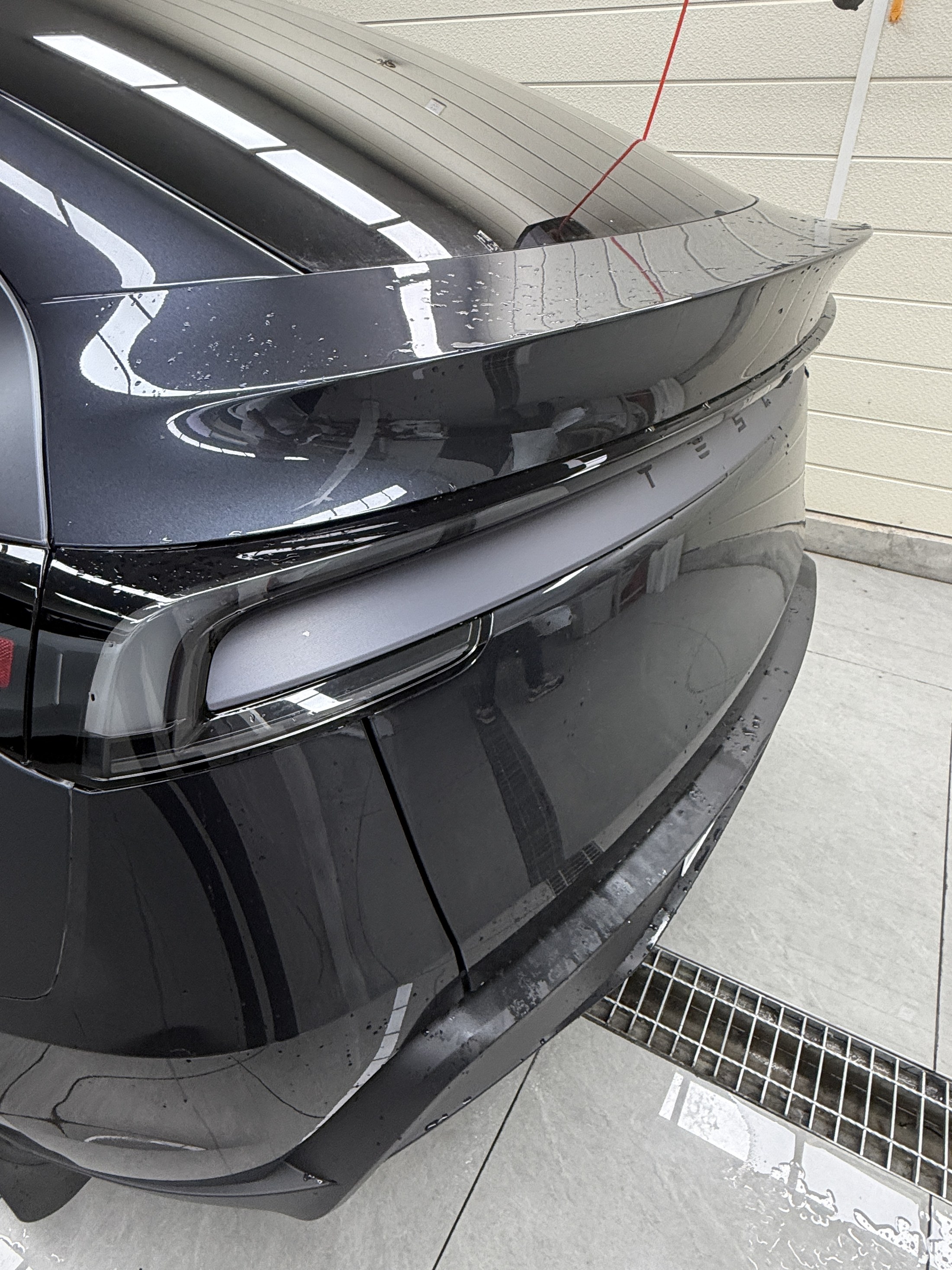 2026 Tesla Model Y Stealth Grey before matte clear PPF, rear quarter