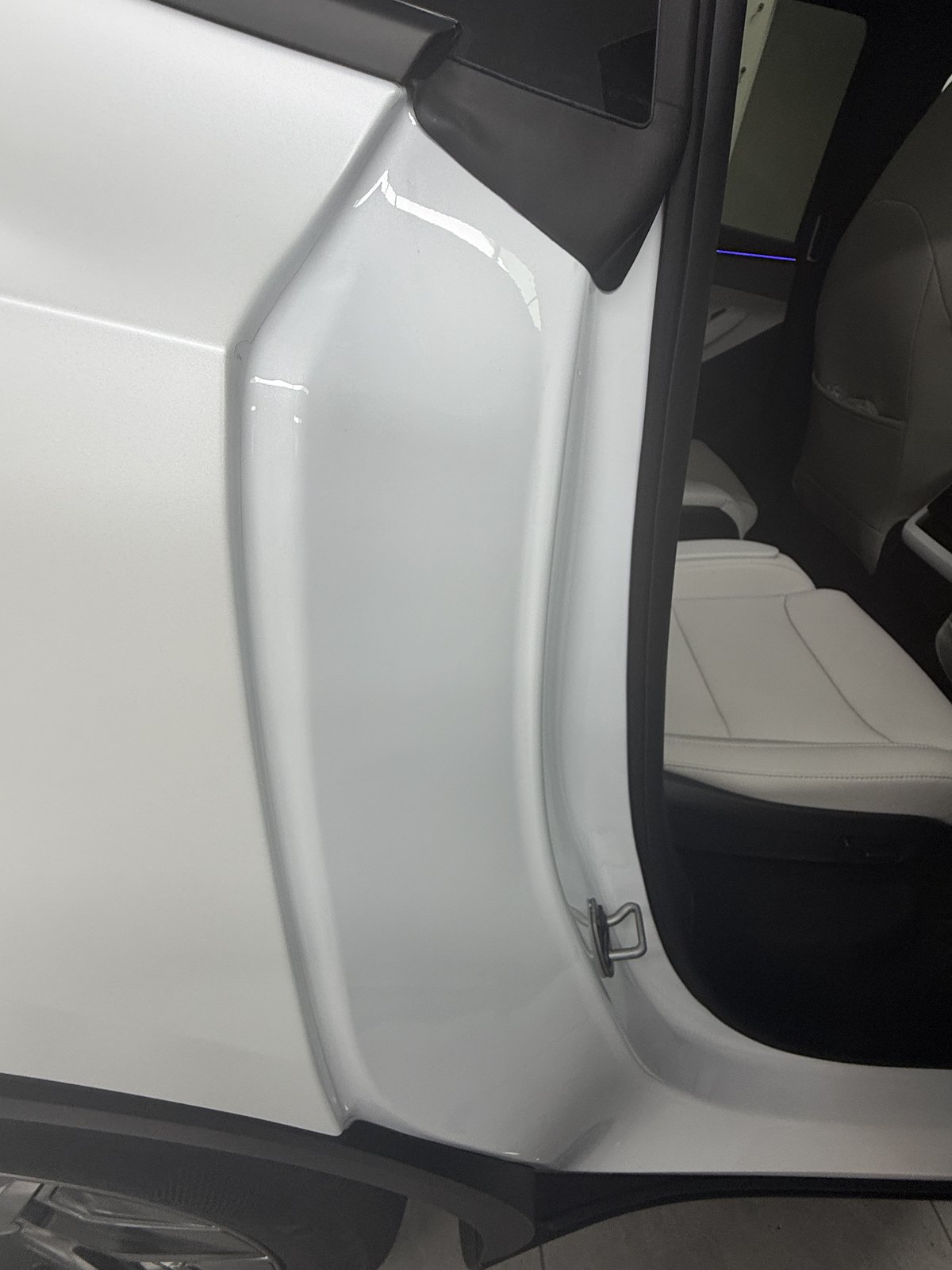 Model Y L door edge with the door open after installation