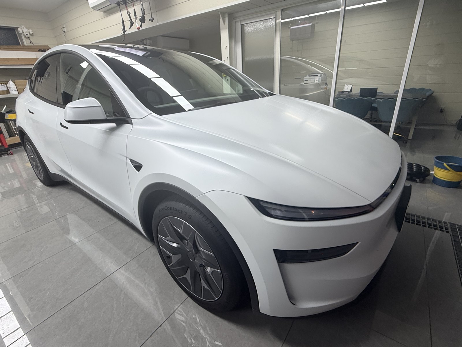 White 2026 Tesla Model Y L after EISUI satin clear PPF, front quarter