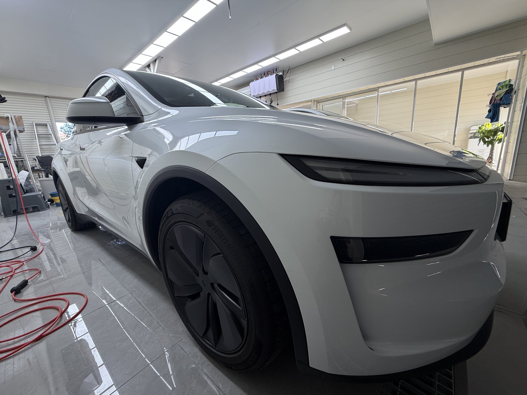 Tesla Model Y Pearl White clear PPF front low angle