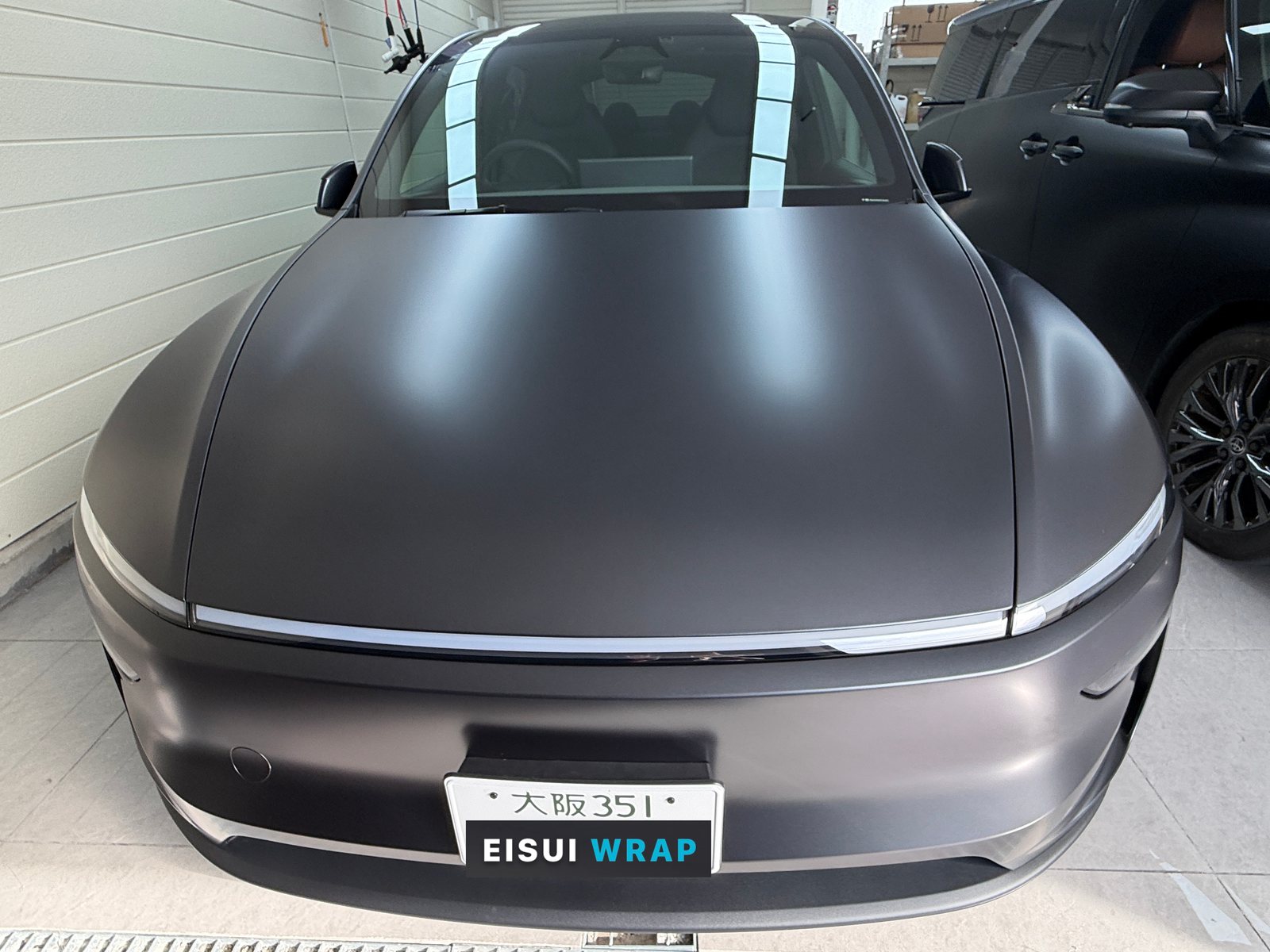2026 Tesla Model Y L Stealth Grey, After: front and windscreen